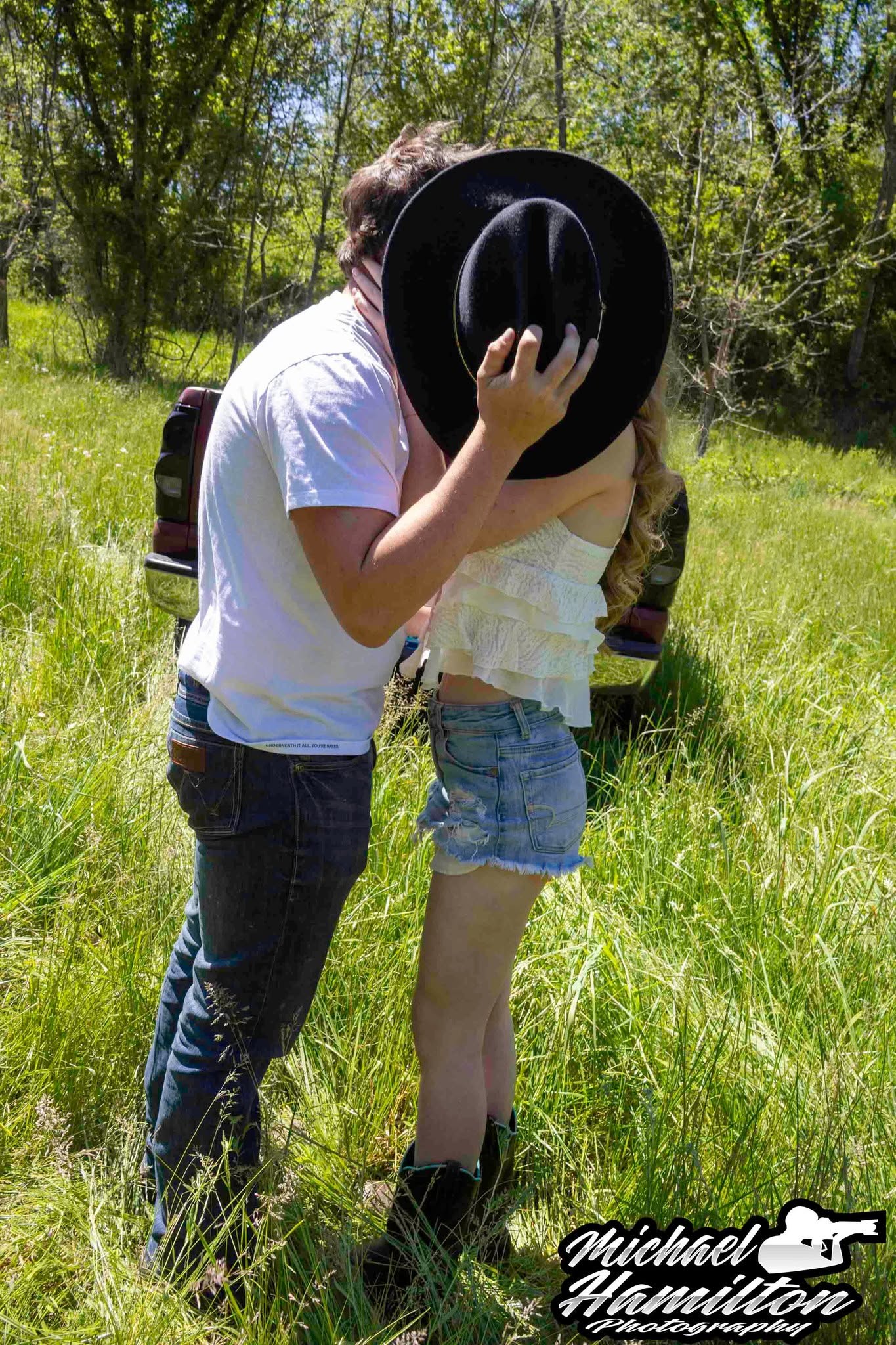 A couple sharing a fun, natural moment during an MHP photo session