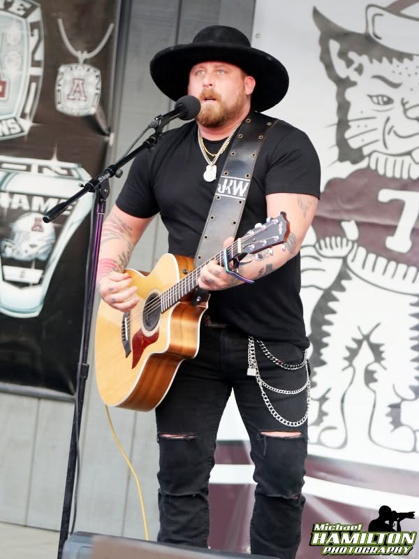 Jesse Keith Whitley performing with a guitar